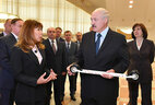 Alexander Lukashenko is shown sports equipment