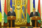 Belarus President Alexander Lukashenko and Ukraine President Petro Poroshenko speak during a press conference