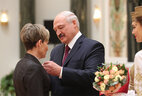 Aleksandr Lukashenko presents the Order of Mother to engineer of the Borisov-based wood processing enterprise Borisovsky DOK Galina Gumenyuk