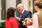 Aleksandr Lukashenko presents the Order of Mother to teacher of the Sorochki kindergarten, Lyuban District, Natalya Mamaiko