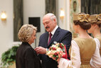 Aleksandr Lukashenko presents the Order of Mother to preschool teacher of the Rabun educational complex, Vileika District, Irina Mikulich