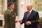 Aleksandr Lukashenko presents general’s shoulder boards to head of the General Staff Department of the Armed Forces – deputy head of the Military Academy of Belarus Sergei Zaytsev