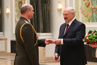 Aleksandr Lukashenko presents general’s shoulder boards to head of the Brest Oblast Department of the State Security Committee Sergei Gladyshev