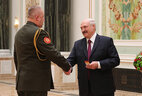 Aleksandr Lukashenko presents general’s shoulder boards to head of the Military Counter-Intelligence Department of the State Security Committee Konstantin Kuchinsky