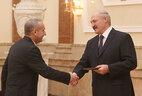 Alexander Lukashenko presents the diploma of the NASB academician to academic secretary of the NASB Department for Physics and Technical Sciences Alexander Laskonyov