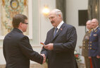 Alexander Lukashenko presents shoulder boards of major general of justice to Maxim Voronin