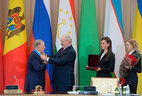 Belarus President Alexander Lukashenko presents the Order of Friendship of Peoples to Kazakhstan President Nursultan Nazarbayev at the extended session of the CIS Heads of State Council