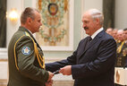 Major-general’s shoulder boards are presented to Sergei Trus