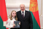 Aleksandr Lukashenko presents a passport to student of Lida secondary school No. 15 Viktoriya Gorbach
