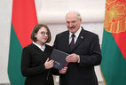 Aleksandr Lukashenko presents a passport to student of Lida secondary school No. 14 Milana Kostyuk