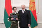 Aleksandr Lukashenko presents a passport to student of Machulishchi secondary school Aleksandr Mochalov