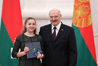 Aleksandr Lukashenko presents a passport to student of Pinsk secondary school No. 11 Mariya Myshkovets