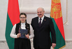 Aleksandr Lukashenko presents a passport to student of Minsk secondary school No. 89 Yelizaveta Polyakova