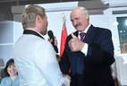 Belarus President Alexander Lukashenko and Russian singer Nikolai Baskov during the opening ceremony