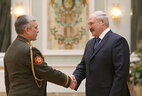 Deputy State Secretary of the Security Council Major General Mikhail Puzikov receives the Honored Specialist of Armed Forces of Belarus title