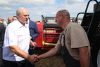 Alexander Lukashenko and combine operator Aleksei Yakovlev
