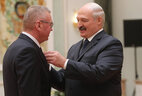 Director of OAO Asilak, Uzda District, Valery Maisyuk receives the Order of Honor