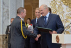 Head of the philosophy and ideological work chair at the Interior Ministry Academy Sergei Maslenchenko receives the President's letter of commendation