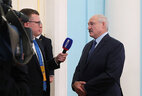Belarus President Aleksandr Lukashenko talks to mass media representatives on the sidelines of the EAEU summit
