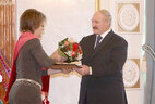 Alexander Lukashenko presents the Doctor of Philology diploma to Zhanna Nekrashevich-Korotkaya