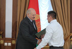 Letter of commendation from the President of Belarus is given to member of the national weightlifting team Yevgeny Tikhontsov