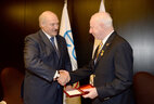 Alexander Lukashenko presents the Medal of Francysk Skaryna to Patrick Hickey for a big personal contribution to the development of the Olympic movement, mass and elite sport in Belarus
