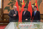 Xi Jinping shows Aleksandr Lukashenko the layouts of a football stadium and a swimming pool which the Chinese side wants to gift to Belarus