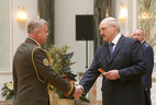 Alexander Lukashenko presents lieutenant general’s shoulder boards to Stanislav Zas