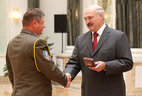 The Order for Service to the Homeland 3rd Class is bestowed upon commander of the 103rd guard mobile brigade Colonel Vladimir Bely