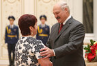 Milker of the agricultural company Rassvet (Kirovsk District) Valentina Klimovich receives the Order of Honor
