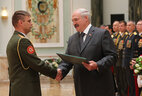 Graduate of the Command and Staff Department of the Military Academy Denis Bernat receives a letter of commendation from the President