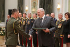 Graduate of the Command and Staff Department of the Military Academy Dmitry Vozovikov receives a letter of commendation from the President