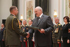 Graduate of the Military Academy of Radiation, Chemical and Biological Defense and Engineer Forces of the Defense Ministry of the Russian Federation Alexei Pavlovich receives a letter of commendation from the President