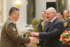 Graduate of the General Staff of the Armed Forces department of the Military Academy of the Republic of Belarus colonel Sergei Lagodyuk receives an official letter of thanks from the President