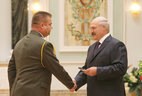 Alexander Lukashenko presents major general’s shoulder boards to Pavel Tikhonov