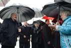 Alexander Lukashenko talks to the resident of Yelsk District