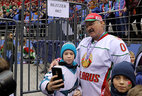 Aleksandr Lukashenko with young ice hockey players