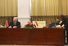 Belarus President Alexander Lukashenko and Sudan President Omar Hassan Ahmad al-Bashir sign bilateral documents after the talks