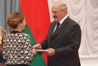 Psychiatrist and narcologist, head of the 27th psychiatric ward at the Belarusian mental health research center Marina Skugarevskaya receives a doctor of medicine diploma