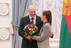 Alexander Lukashenko presents the Order for Personal Courage to four-time Olympic champion, many-time medalist of the Olympic Games Darya Domracheva