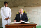Belarus President Alexander Lukashenko leaves a message in the Book of Distinguished Guests at Raj Ghat memorial