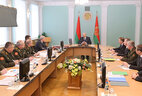 Alexander Lukashenko hears out a report on the development priorities of the Armed Forces