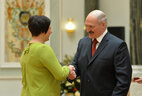 Alexander Lukashenko presents the Order of Mother to Alla Madudina