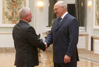 Valery Shlyaga, Chairman of Narovlya District Executive Committee, is presented with the Order of Honor