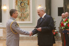 Alexander Lukashenko presents shoulder boards of major general of financial police to Igor Marshalov