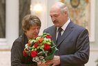 Alexander Lukashenko presents the state decoration to the mother of Captain Andrei Novitsky who was posthumously awarded the Order for Service to the Homeland 3rd Class