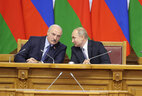Belarus President Aleksandr Lukashenko and Russian President Vladimir Putin during a plenary session of the 6th Forum of Regions of Belarus and Russia