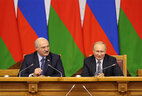 Belarus President Aleksandr Lukashenko and Russian President Vladimir Putin during a plenary session of the 6th Forum of Regions of Belarus and Russia