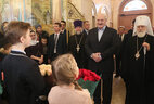 Belarus President Aleksandr Lukashenko, Patriarchal Exarch of All Belarus, Metropolitan of Minsk and Zaslavl Pavel, Archpriest Fyodor Povny in the Memorial Church of All Saints