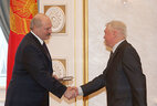 Alexander Lukashenko presents a certificate of professor of geography to head of the limnology research lab of the Belarusian State University Boris Vlasov